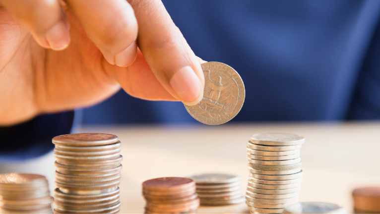 Man stacking coins