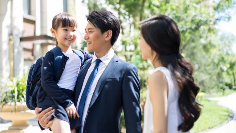 Businessman with his wife and daughter