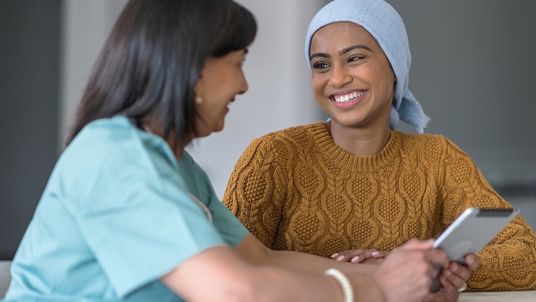 Nurse talking to cancer patient