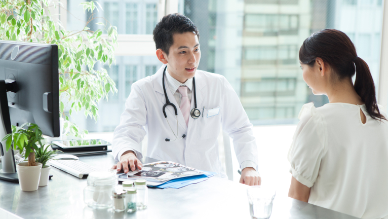 Doctor checking patient’s blood pressure