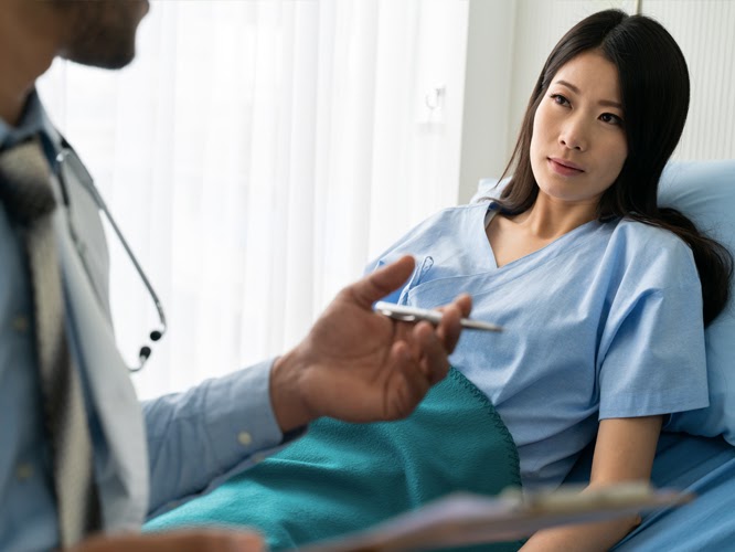 Doctor checking on patient