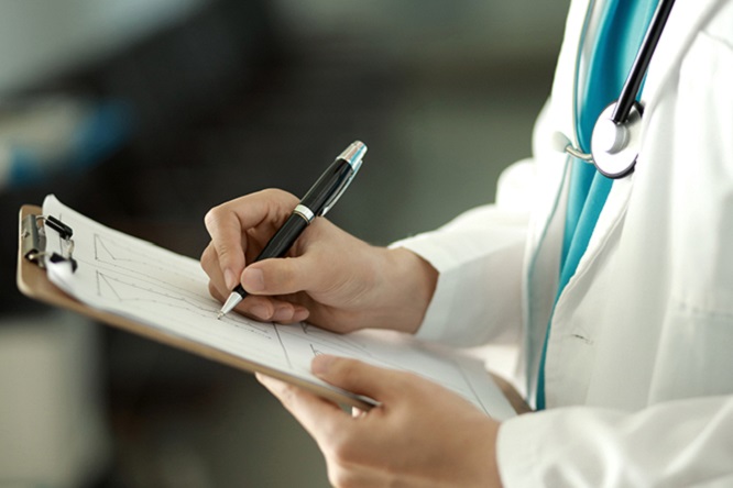 doctor writing notes clipboard