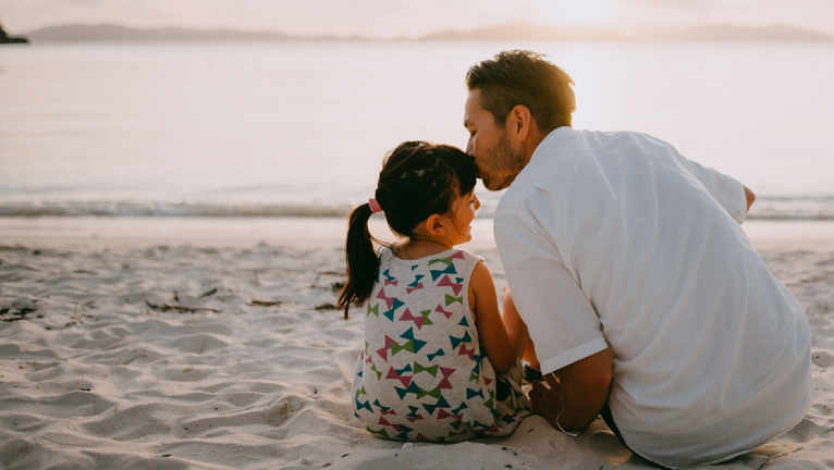 Father and daughter at the beach