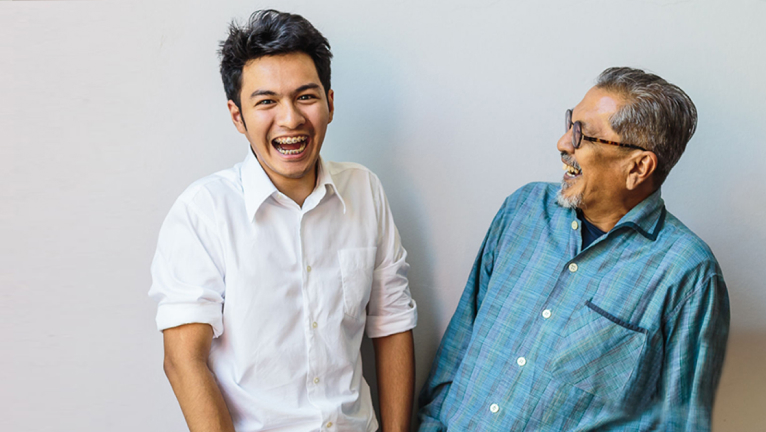 Father and son laughing together