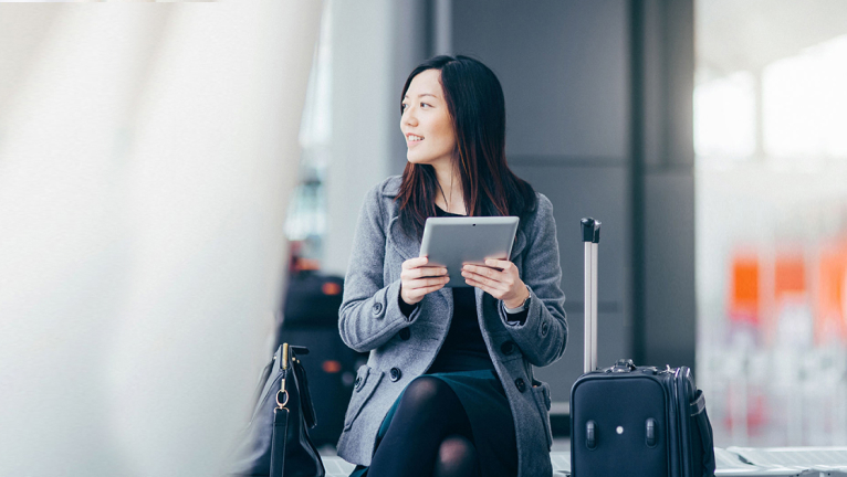 Girl waiting at airport boarding gate