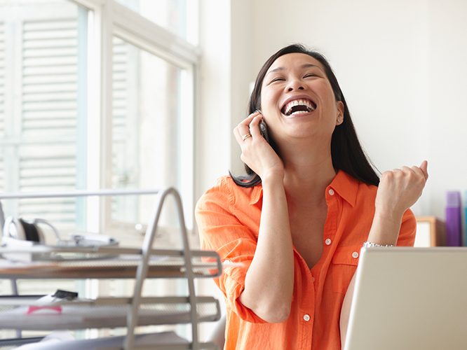Girl talking on the phone happily
