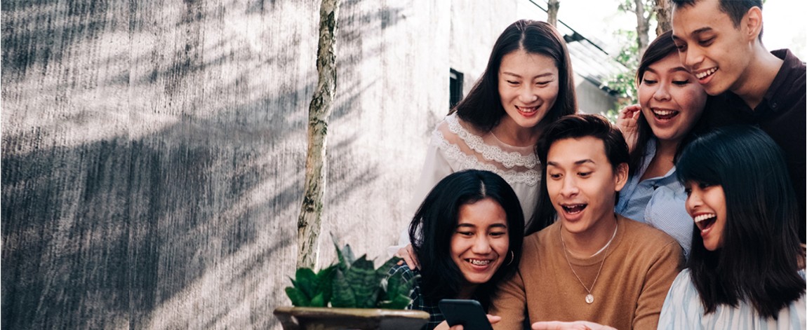 Group looking at a phone screen