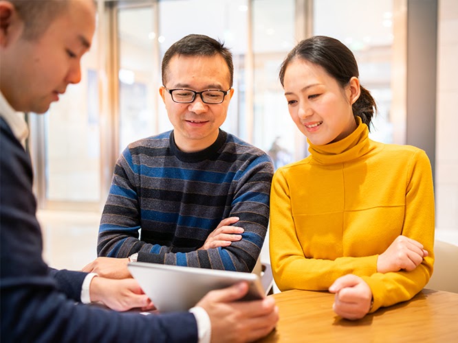 Couple enquiring about life insurance
