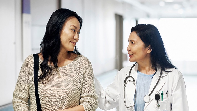 Lady talking to doctor