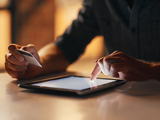 Man making payment on tablet