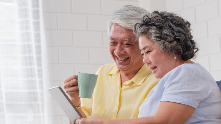 Old couple reading document