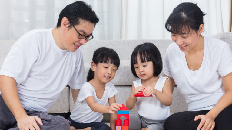 Family playing lego together